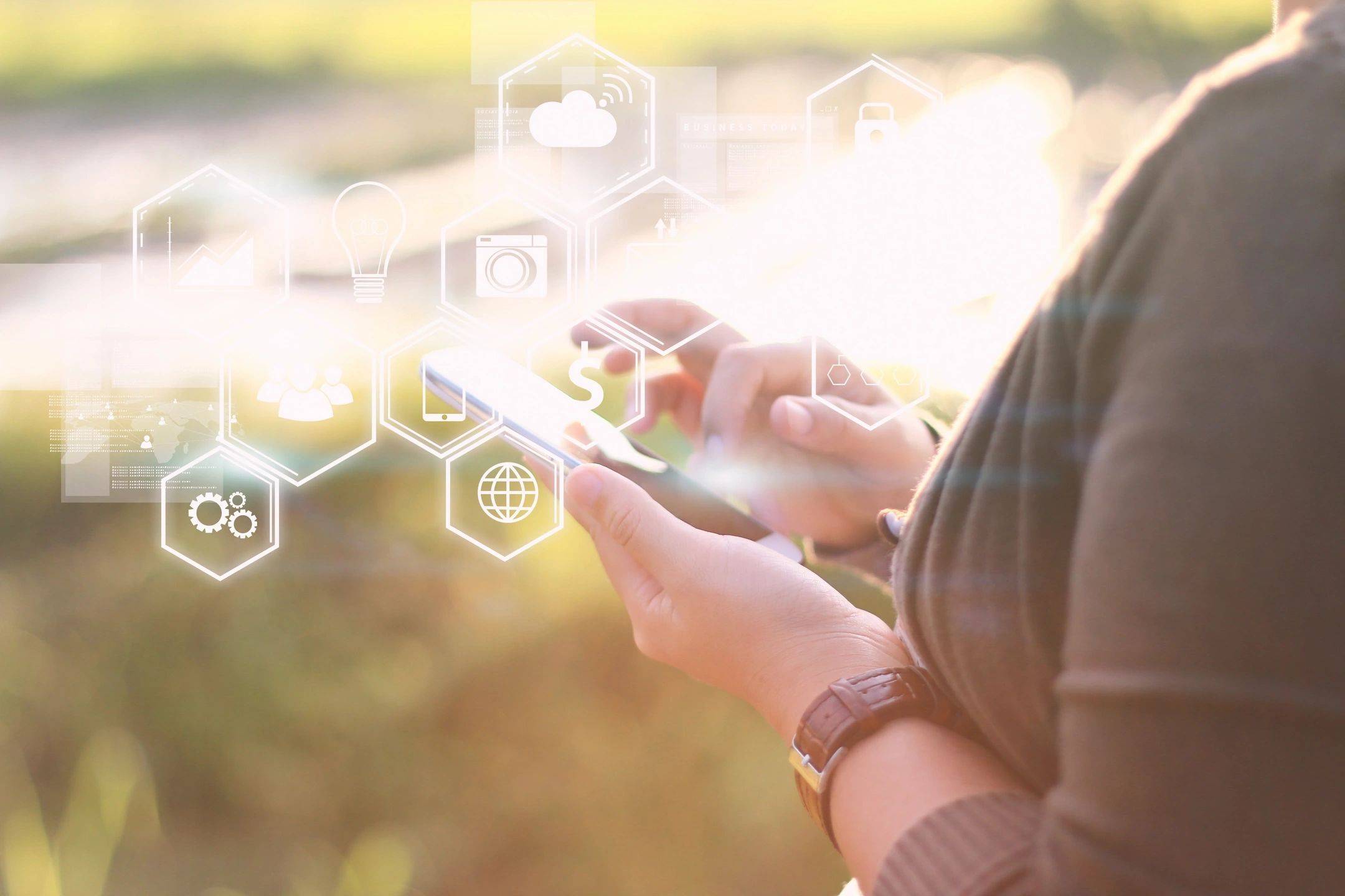 close up of a woman holding a phone, with various social and digital icons overlayed in white.